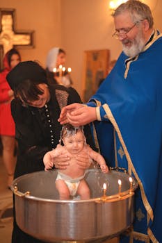 A joyful baptism ceremony in a church with a baby and priest.